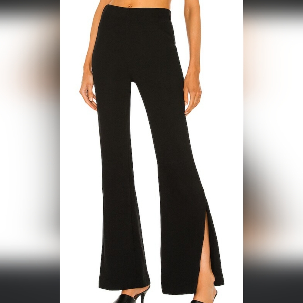 High waisted black knit flare pants with slit